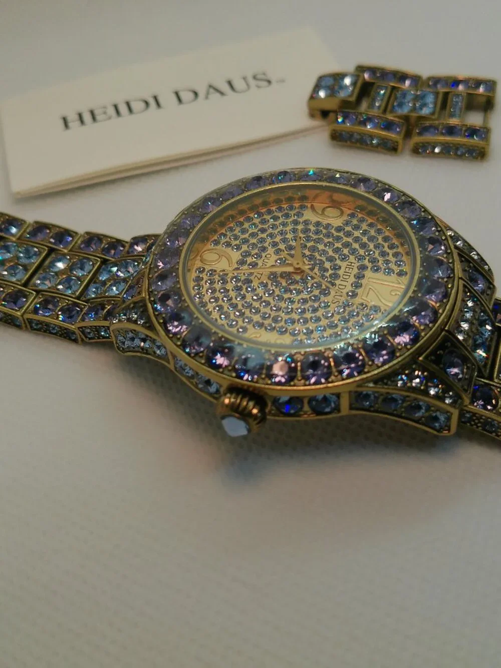 Heidi Daus quartz fashion watch bronze-tone covered with lavender-purple crystal